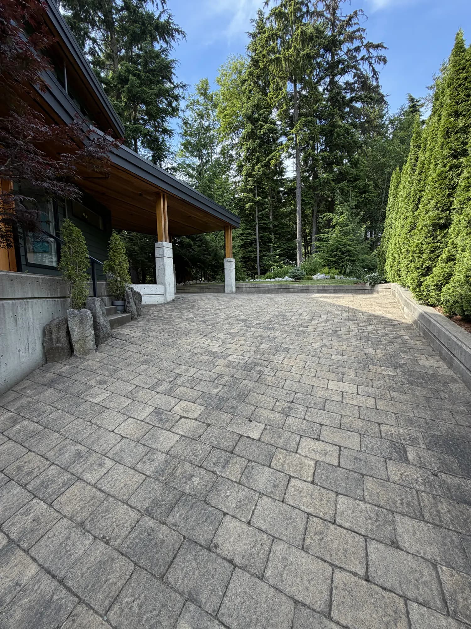 Paver entry courtyard before restoration, the surface grey and the joints washed out